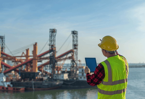 A man in the marine and industrial engineering industry analysing an installation of an industrial water mixer 