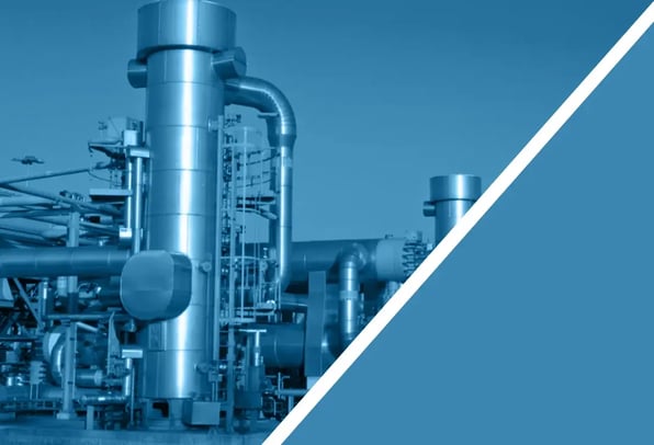 Industrial hydrocarbon processing facility with large stainless steel process vessels and pipework, representing static mixer applications in the oil, gas and petrochemical industry.