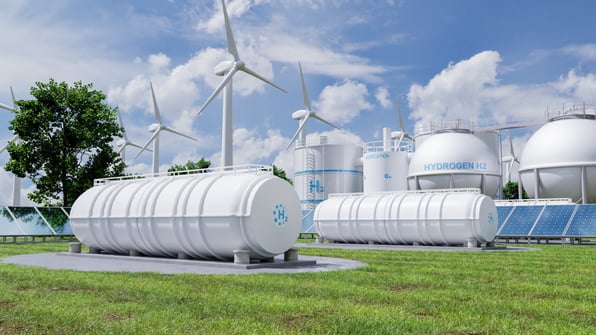 Static mixers supporting green hydrogen production alongside hydrogen storage tanks, wind turbines and solar panels.