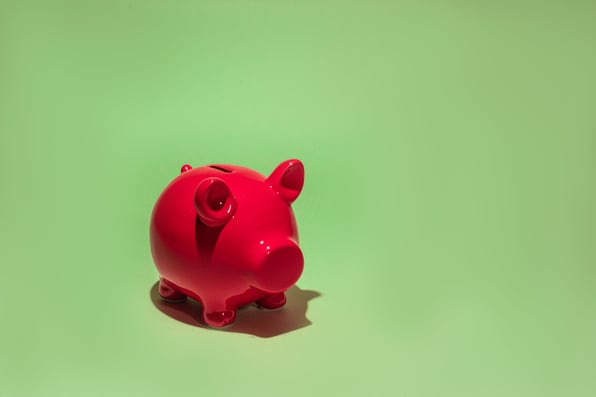 A pink piggy bank to show the cost-saving benefits of a static mixer