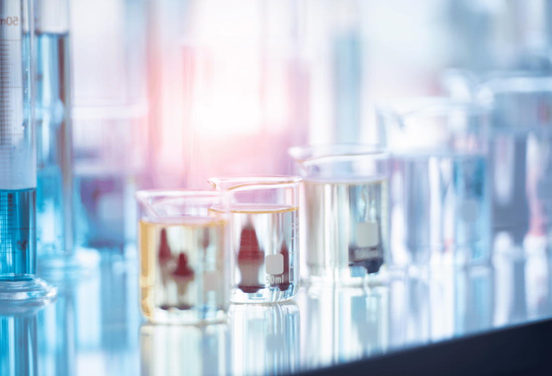  An image of chemicals in jars highlighting the importance of chemical injection lances in mixing processes.  