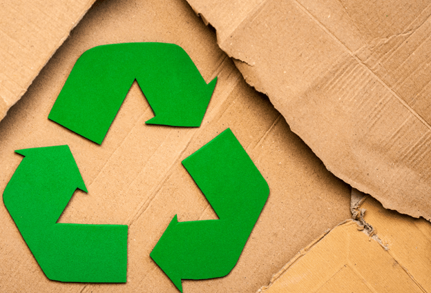 A recycling symbol on cardboard connoting static mixers being an environmentally friendly solution. 